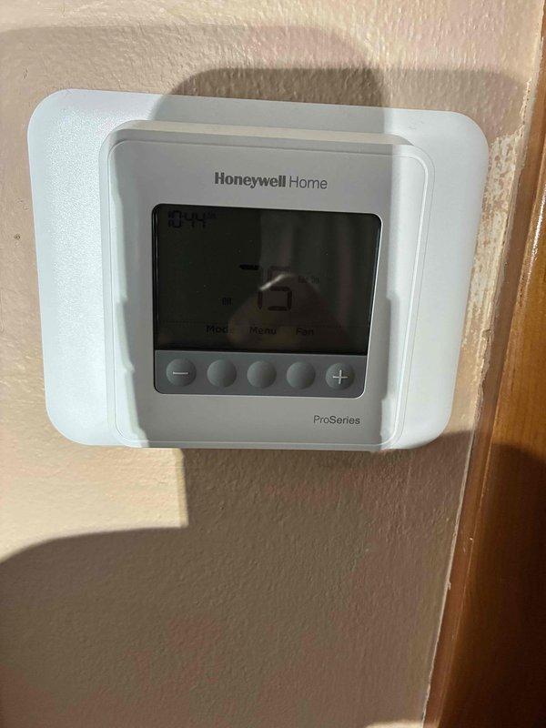 Completed comprehensive HVAC tune-up service on residential air conditioning system. Performed standard maintenance procedures including inspection of outdoor condenser unit, verification of electrical connections at disconnect box, and confirmed proper thermostat operation on Honeywell Home ProSeries unit. System tested and operating within normal parameters.