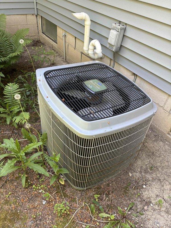 Completed scheduled cooling system maintenance visit as part of prepaid membership program. Performed comprehensive A/C tune-up on outdoor condensing unit, including inspection of compressor, condenser coil, refrigerant levels, and electrical connections. Installed Patriot UV lamp system to improve indoor air quality and prevent microbial growth within the air handler. Inspected air handler interior, noting significant rust and corrosion on metal components and drain pan, which will require monitoring for potential future replacement. Cleaned and secured electrical wiring connections. Verified proper system operation and airflow. Unit is currently functioning within normal parameters despite visible aging of internal components.