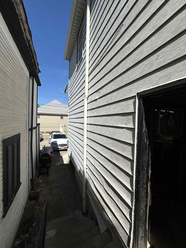 Conducted site evaluation for mini split installation in commercial kitchen environment. Assessed exterior access pathway between buildings for condenser placement and line set routing, and evaluated interior kitchen workspace to determine optimal indoor unit positioning for adequate climate control in active food service area.