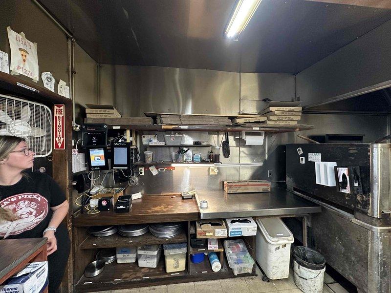 Conducted site evaluation for mini split installation in commercial kitchen environment. Assessed exterior access pathway between buildings for condenser placement and line set routing, and evaluated interior kitchen workspace to determine optimal indoor unit positioning for adequate climate control in active food service area.
