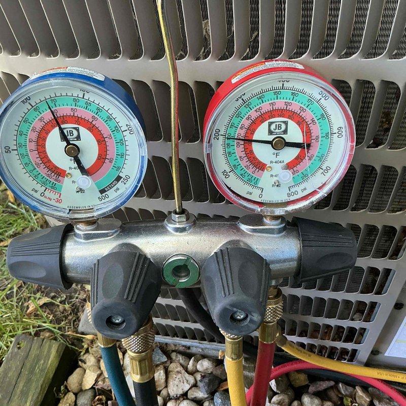 Completed annual air conditioning tune-up and system performance evaluation. Measured refrigerant pressures using manifold gauge set and verified temperature differential across the evaporator coil with digital multimeter, confirming proper system operation and refrigerant charge levels within manufacturer specifications.