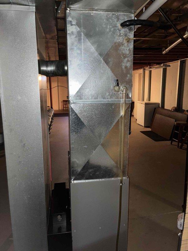 Responded to no cooling call for residential HVAC system. Upon arrival, inspected indoor air handler unit located in basement and outdoor condensing unit on exterior concrete pad. System showed signs of age with visible weathering on equipment. Diagnosed cooling issue, performed necessary repairs to restore proper operation, and verified system functionality before departure.