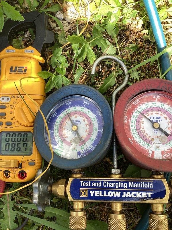 Responded to no cooling complaint on residential split system air conditioning unit. Upon arrival, performed diagnostic testing using manifold gauges and multimeter to assess system operation and electrical parameters. Verified condenser unit functionality, inspected outdoor equipment for proper airflow through louvered panels, and confirmed fan operation through protective grille. System evaluation completed with testing equipment to determine root cause of cooling failure.