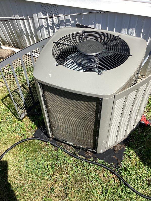 Responded to no cooling complaint on residential split system air conditioning unit. Upon arrival, performed diagnostic testing using manifold gauges and multimeter to assess system operation and electrical parameters. Verified condenser unit functionality, inspected outdoor equipment for proper airflow through louvered panels, and confirmed fan operation through protective grille. System evaluation completed with testing equipment to determine root cause of cooling failure.