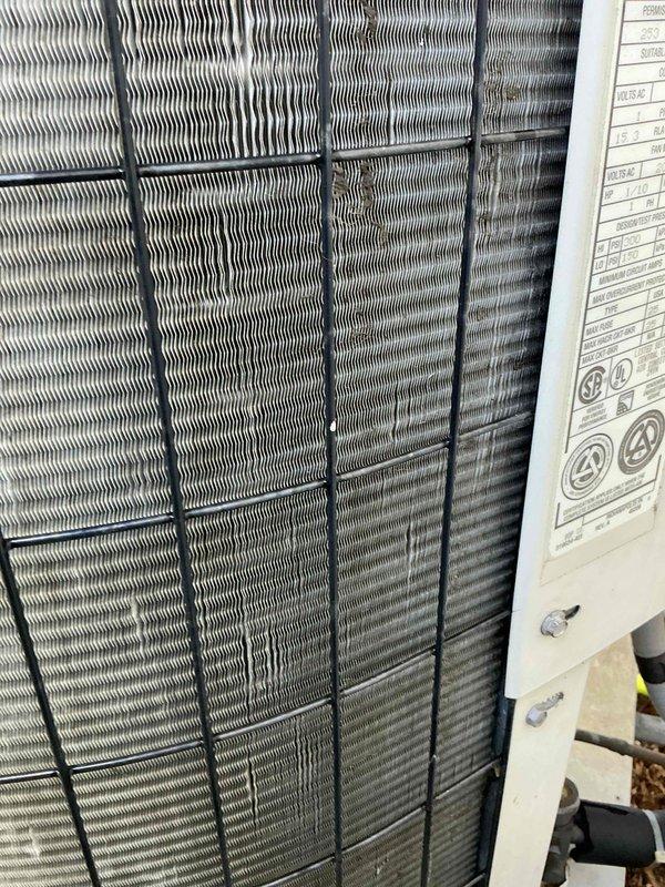 Completed comprehensive air conditioning tune-up on outdoor condenser unit. Performed visual inspection of heat exchanger coils, verified proper fin condition and spacing, checked refrigerant line connections, and documented equipment specifications. Unit found to be operating within normal parameters with all components in good working condition.