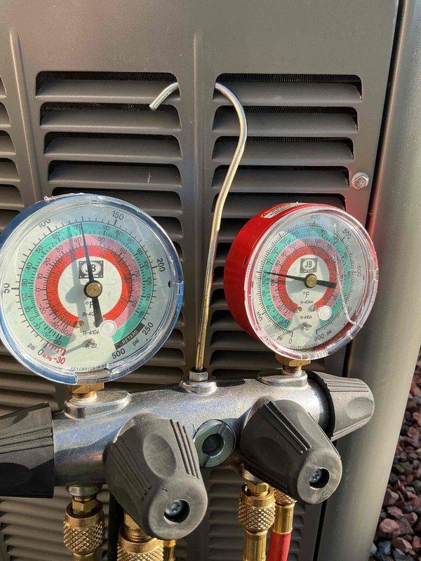 Completed comprehensive preventive maintenance tune-ups on two air conditioning systems as part of installation agreement. Performed electrical diagnostics using digital multimeter to verify proper voltage and amperage readings at outdoor unit, tested refrigerant pressures on both high and low sides using manifold gauge set to confirm system charge levels within manufacturer specifications, inspected all electrical connections and refrigerant line sets, and documented equipment performance with photos for service records.