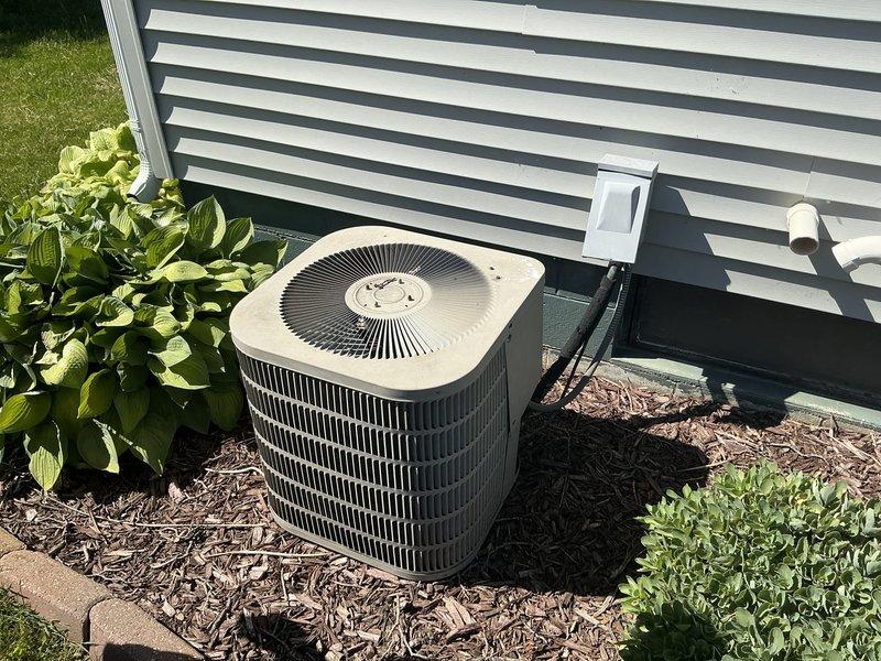 Responded to emergency service call for AC system evaluation and provided comprehensive replacement estimate. Assessed existing outdoor condenser unit and indoor furnace/air handler system, documented current equipment condition through detailed photography of both exterior and interior components. Evaluated complete HVAC system configuration including ductwork, electrical connections, and overall installation setup to determine replacement requirements and specifications.