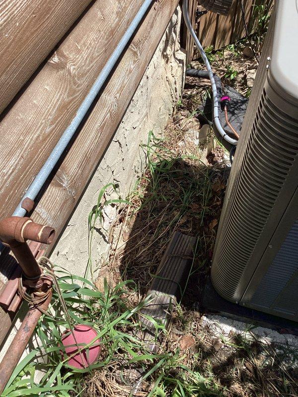 Completed full HVAC system installation including furnace and air conditioning condenser unit. Installed outdoor AC unit with proper refrigerant line connections, electrical conduit routing, and junction box mounting. All copper refrigerant lines properly insulated with protective foam coverings and secured along exterior wall. System tested and verified operational upon completion.