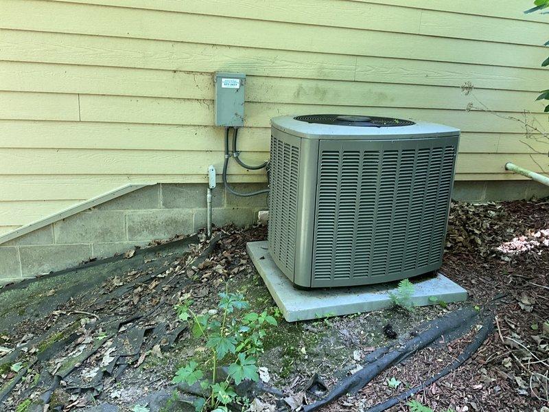 Conducted comprehensive assessment of 18-year-old Lennox zoned HVAC system located in basement. Evaluated existing furnace and air conditioning equipment, documented outdoor condenser unit condition showing weathering and algae growth on concrete pad, and inspected basement ductwork installation including UV air purification device and refrigerant lines. Provided replacement estimate with multiple equipment brand options to meet customer requirements for complete system upgrade.