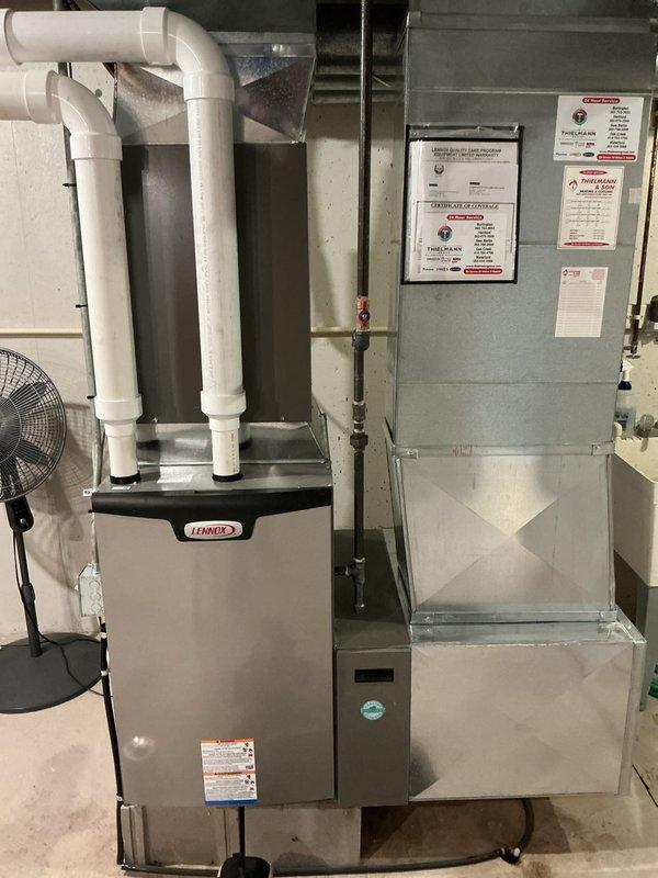 Completed prepaid cooling system maintenance visit as part of membership agreement. Investigated reported condensation leak near furnace switch and PVC piping, inspected Lennox furnace and associated drainage system, examined indoor air handler unit and outdoor condenser unit for proper operation. Documented equipment condition with photos showing all major system components functioning properly with no visible damage or deterioration.