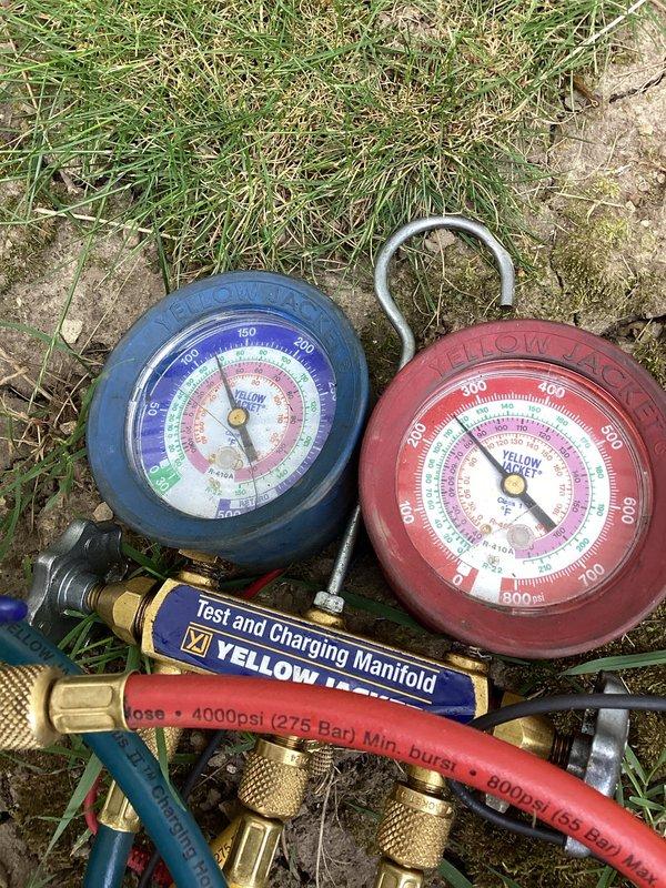 Responded to no cooling complaint on 10+ year old residential air conditioning system. Connected manifold gauges to condenser unit and performed refrigerant pressure diagnostics, revealing system operating outside normal parameters. Completed service evaluation and testing procedures to identify cooling failure cause.