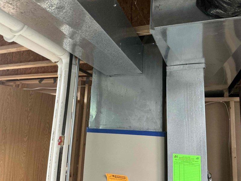 Conducted comprehensive assessment of existing HVAC system in residential basement installation for furnace and air conditioning replacement estimate. Documented current system configuration including galvanized ductwork, existing furnace cabinet, and air distribution components. Evaluated equipment accessibility, existing infrastructure, and utility connections to provide accurate replacement specifications for non-functional air conditioning unit and aging furnace system.