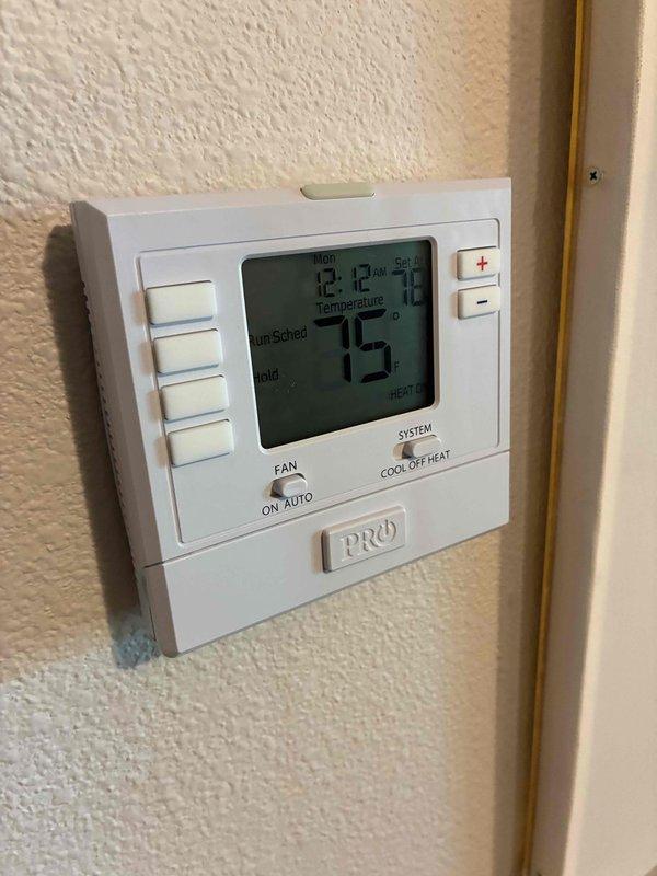 Responded to callback for air conditioning unit that would not shut off. Upon arrival, inspected PRO1 programmable thermostat and found system continuously running. Diagnosed faulty thermostat relay causing compressor to remain energized regardless of temperature setpoint. Verified outdoor condensing unit operation and confirmed proper electrical connections at disconnect box. Issue resolved and system cycling properly at departure.