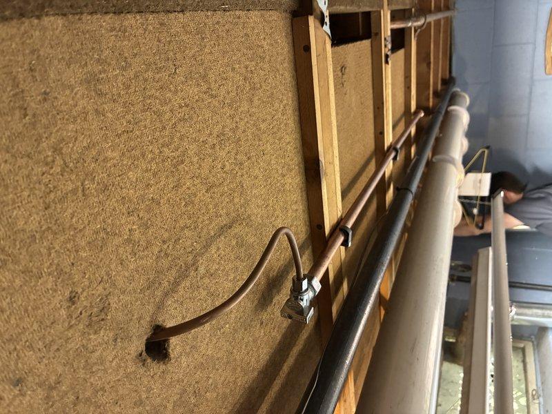 Installed new 3/4" copper waterline from main supply to kitchen area for refrigerator ice maker connection. Ran line through wall framing and secured with proper fasteners and support straps per code requirements. Installed new exterior hose bib on side of structure with appropriate backflow prevention and shutoff valve for seasonal maintenance.