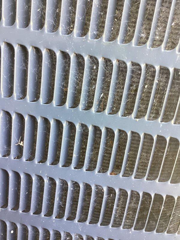 Completed standard AC tune-up maintenance on residential air conditioning system. Inspected outdoor disconnect panel and electrical components including capacitor, contactors, and wiring connections; verified proper operation. Examined indoor air return grille, noting dust and debris accumulation, and provided estimate for duct cleaning services to improve system efficiency and indoor air quality.