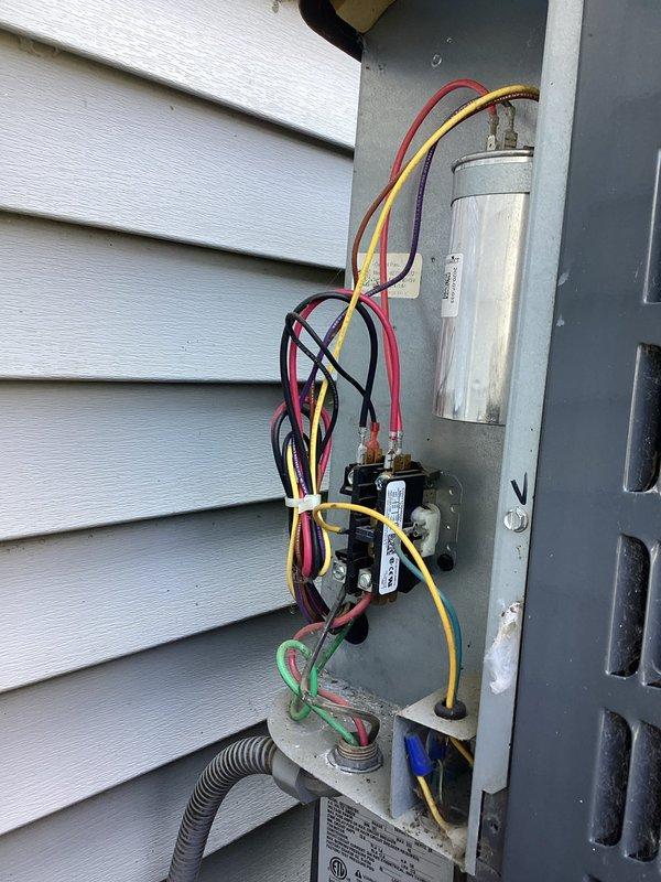 Completed standard AC tune-up maintenance on residential air conditioning system. Inspected outdoor disconnect panel and electrical components including capacitor, contactors, and wiring connections; verified proper operation. Examined indoor air return grille, noting dust and debris accumulation, and provided estimate for duct cleaning services to improve system efficiency and indoor air quality.