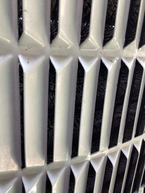 Completed comprehensive air conditioning tune-up on residential outdoor condenser unit. Performed standard maintenance inspection including visual assessment of cabinet condition, fan guard, condenser coils, and refrigerant line connections. Unit found in normal operating condition with minor debris accumulation around base, typical for exterior installation.