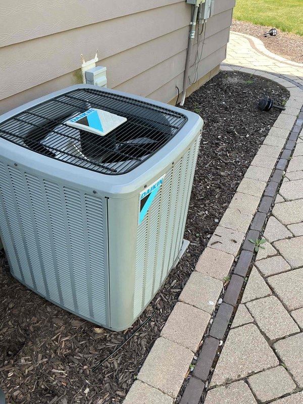 Performed comprehensive tune-up on residential air conditioning system. Conducted operational testing and measured compressor amperage at 4.72A, which falls within normal operating parameters. Unit demonstrated proper cooling performance with significant condensation present on evaporator coil surfaces, indicating adequate refrigerant charge and heat exchange. Inspected outdoor condenser unit, confirmed proper installation on mulch bed with adequate clearance, and verified all mechanical and electrical components functioning correctly.