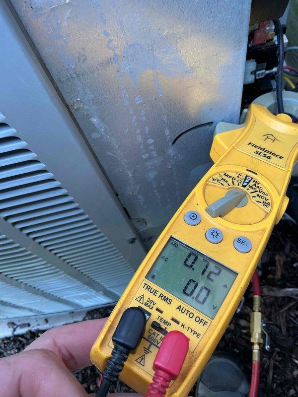 Performed comprehensive tune-up on residential air conditioning system. Conducted operational testing and measured compressor amperage at 4.72A, which falls within normal operating parameters. Unit demonstrated proper cooling performance with significant condensation present on evaporator coil surfaces, indicating adequate refrigerant charge and heat exchange. Inspected outdoor condenser unit, confirmed proper installation on mulch bed with adequate clearance, and verified all mechanical and electrical components functioning correctly.