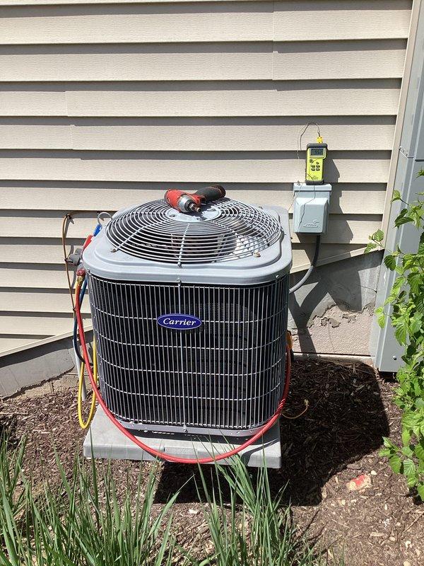 Performed comprehensive air conditioning tune-up on Carrier condensing unit, including system diagnostics with Yellow Jacket Titan 4-valve manifold gauges to verify refrigerant pressures and charge levels. Connected refrigerant hoses to service ports, tested electrical components with digital meter at disconnect box, and confirmed proper system operation and performance within manufacturer specifications.