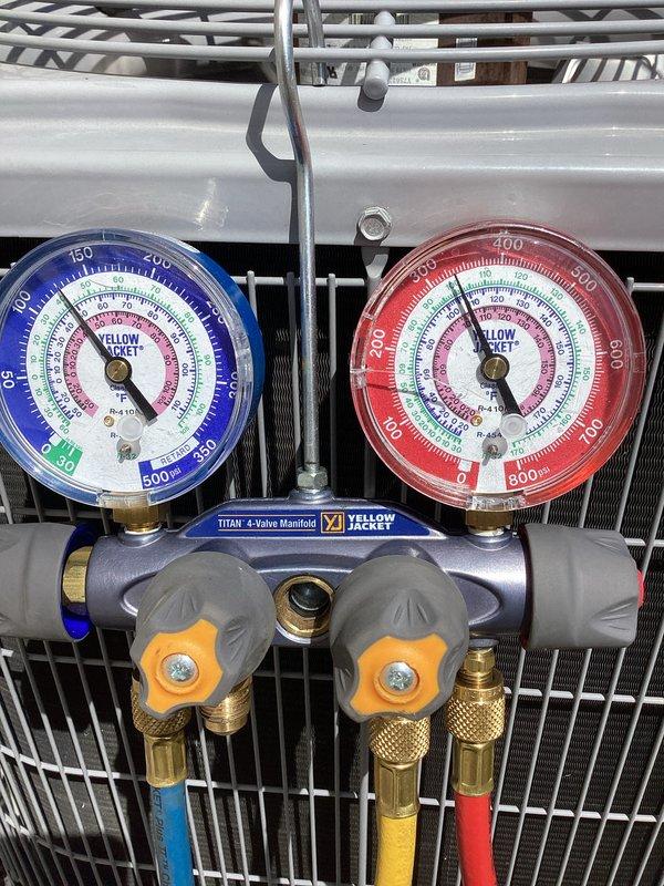 Performed comprehensive air conditioning tune-up on Carrier condensing unit, including system diagnostics with Yellow Jacket Titan 4-valve manifold gauges to verify refrigerant pressures and charge levels. Connected refrigerant hoses to service ports, tested electrical components with digital meter at disconnect box, and confirmed proper system operation and performance within manufacturer specifications.