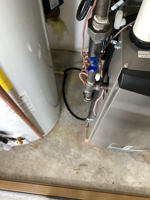 # HVAC System Installation

Successfully completed a full air conditioning system installation featuring a Lennox vertical air handler unit. The installation included mounting the air handler in the utility closet, establishing all refrigerant line connections with copper piping, and installing white PVC condensate drain lines to the top section of the unit. Electrical wiring was professionally routed and connected to power the system. All components were installed per manufacturer specifications and industry standards, with proper clearances maintained for future maintenance access. The installation site was left clean and organized, with all plumbing connections, drainage systems, and electrical work completed to code requirements.