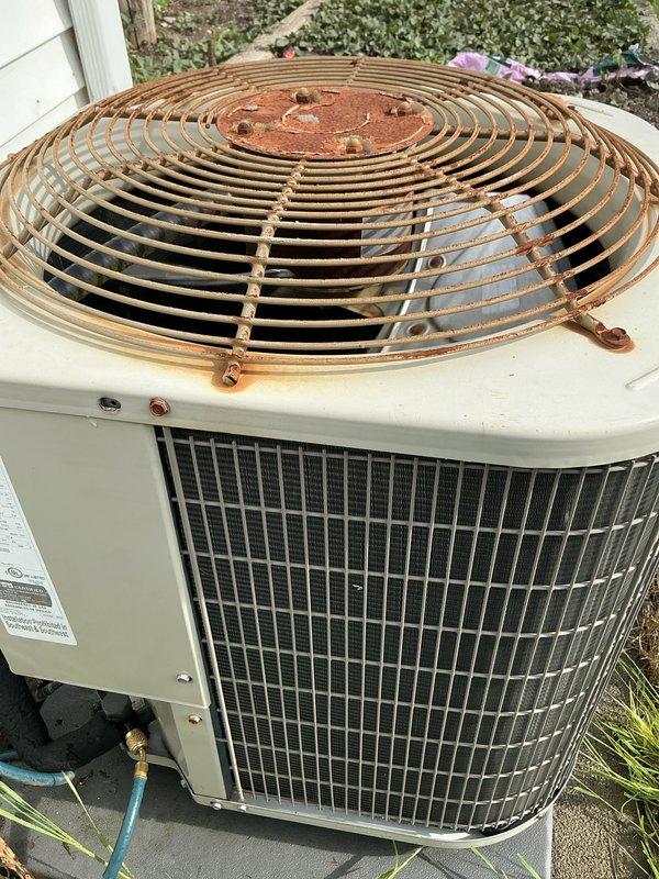 Responded to no cooling call on aging outdoor heat pump unit. Upon arrival, connected manifold gauge set to assess refrigerant pressures and system operation. Unit showed significant weathering with heavily rusted fan guard and evidence of extended outdoor exposure. Performed diagnostic evaluation of system pressures and overall equipment condition. Collected equipment information and documented unit condition with photos for customer records. Customer requested specific technician for follow-up service needs.