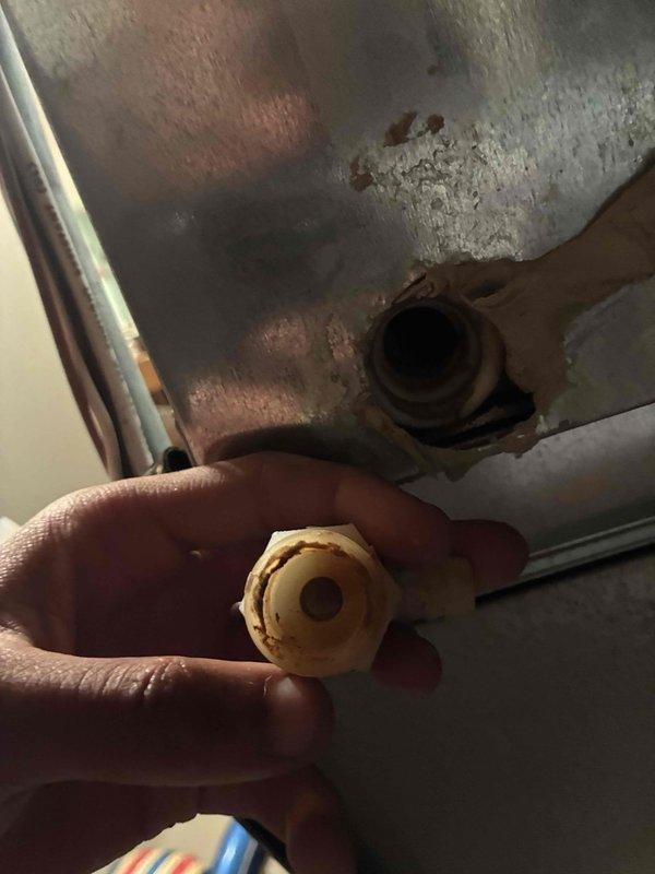 Responded to no cooling complaint on residential HVAC system over 10 years old. Upon inspection, identified refrigerant leak at brass flare fitting connection, evidenced by visible corrosion and wear on component. Replaced defective fitting, pressure tested system, recharged refrigerant to manufacturer specifications, and verified proper cooling operation before departure.
