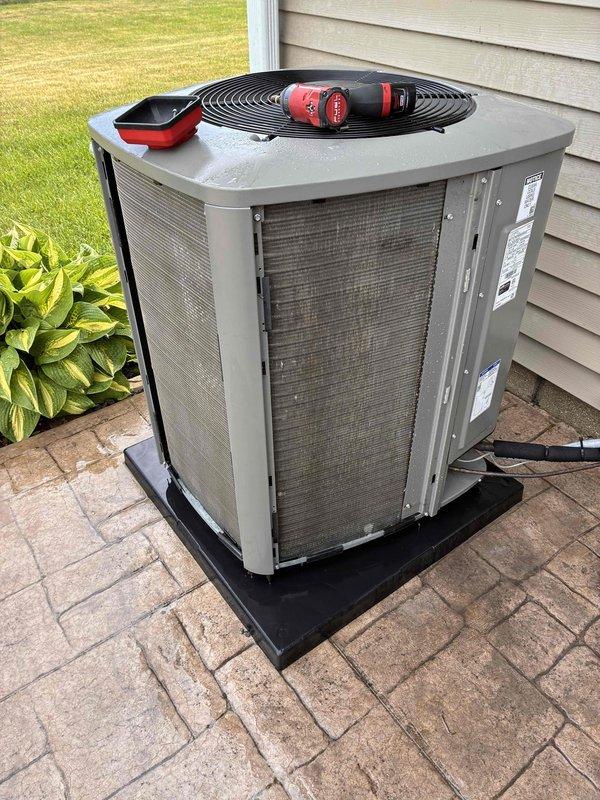 Completed seasonal A/C tune-up on outdoor condensing unit, performing standard preventative maintenance procedures including inspection of electrical connections, refrigerant levels, and condenser coil cleaning. Unit operational and running within normal parameters upon completion of service.