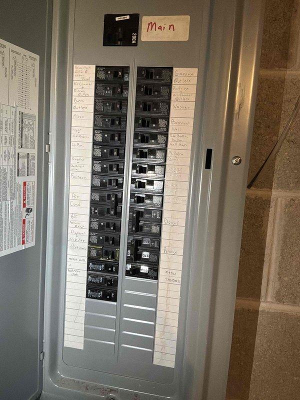 Completed on-site assessment for replacement estimate of existing natural gas furnace and air conditioning system, both operational but over 20 years old. Documented current Lennox furnace installation in basement utility area with associated ductwork, electrical panel configuration, and surrounding HVAC infrastructure including water heater proximity and available workspace for equipment replacement.