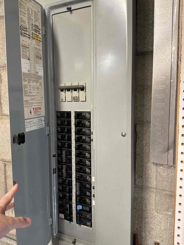 Conducted comprehensive on-site assessment for complete HVAC system replacement, evaluating existing outdoor air conditioning condenser unit and natural gas furnace system. Documented current equipment configuration including exterior condenser unit positioned on concrete pad with proper drainage and existing electrical service panel with circuit breaker distribution system. Provided detailed replacement estimate for new air conditioning system and natural gas furnace to be installed in basement location.