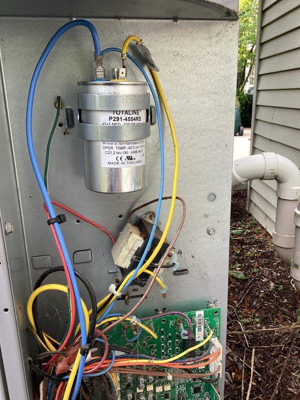 # HVAC Service Completed

Responded to a no cooling call with system failure indication. Upon arrival, performed diagnostic evaluation of the outdoor condensing unit. Inspected electrical control panel and internal components including the Totaline dual run capacitor, control boards, and associated wiring connections.

Utilized Yellow Jacket manifold gauge set to check refrigerant pressures and system operating parameters. Tested electrical components with multimeter to verify proper voltage and continuity. All wiring connections were found intact and properly terminated to capacitor terminals and control boards.

Identified system failure cause and restored cooling operation. Unit tested and confirmed operational at time of departure.