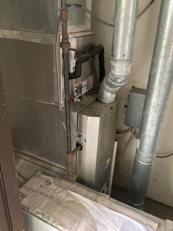 Completed scheduled cooling system maintenance visit as part of family membership plan. Performed comprehensive A/C tune-up including inspection of indoor furnace unit and outdoor Carrier condenser, checked refrigerant pressures using manifold gauges, inspected ductwork and refrigerant lines for proper condition, and verified system operation for optimal performance.