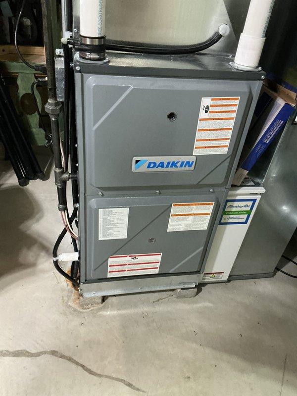 Completed scheduled cooling system tune-up on Daikin HVAC unit as part of recurring membership maintenance visit. Performed comprehensive system inspection, installed customer-provided 20x25 Secure Air filter, and verified all components operating within manufacturer specifications. Unit found in good working condition with proper refrigerant levels, clean condensate drainage through PVC lines, and secure electrical connections.