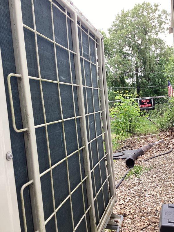 Completed preventative maintenance tune-up on single-head mini-split system. Inspected outdoor condenser unit with protective grille cage, checked refrigerant pressures using manifold gauges showing R-410A readings within normal operating range, and verified system operation. Unit found in satisfactory working condition with no immediate service needs identified.