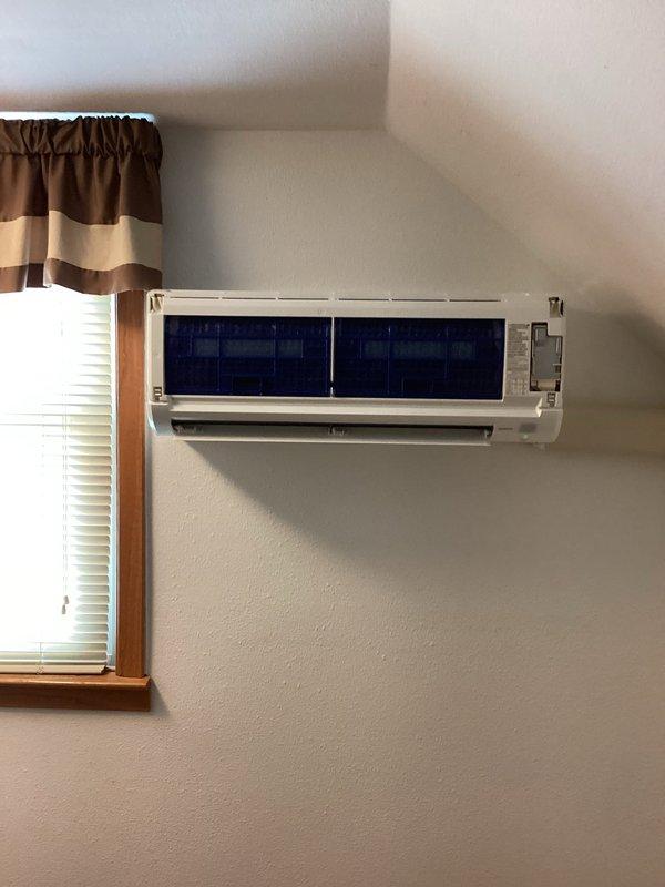 Completed preventive maintenance tune-up on dual-head Mitsubishi ductless mini-split system. Inspected and serviced both indoor wall-mounted air handlers and outdoor condensing unit, checked refrigerant levels, cleaned filters, and verified proper system operation. Assessed blower wheels for cleaning requirements and documented equipment condition with photographs for customer review.