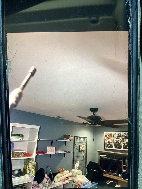 Responded to no cooling complaint with 6 PM arrival. Upon inspection, accessed HVAC system through interior wall chase where flexible ductwork and PVC drain line were observed running vertically through framing. System evaluated and cooling issue resolved during service call.