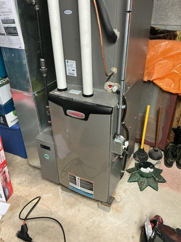 Completed comprehensive tune-up service on Lennox furnace and air conditioning system. Performed standard maintenance inspection of all system components, verified proper operation of heating and cooling functions, checked refrigerant lines and connections, inspected PVC intake and exhaust venting for proper installation and clearance, and confirmed electrical connections at disconnect panel. All equipment found to be operating within normal parameters with no immediate service needs identified.