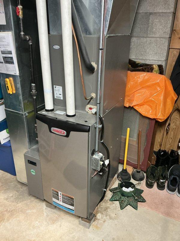 Completed comprehensive tune-up service on Lennox furnace and air conditioning system. Performed standard maintenance inspection of all system components, verified proper operation of heating and cooling functions, checked refrigerant lines and connections, inspected PVC intake and exhaust venting for proper installation and clearance, and confirmed electrical connections at disconnect panel. All equipment found to be operating within normal parameters with no immediate service needs identified.