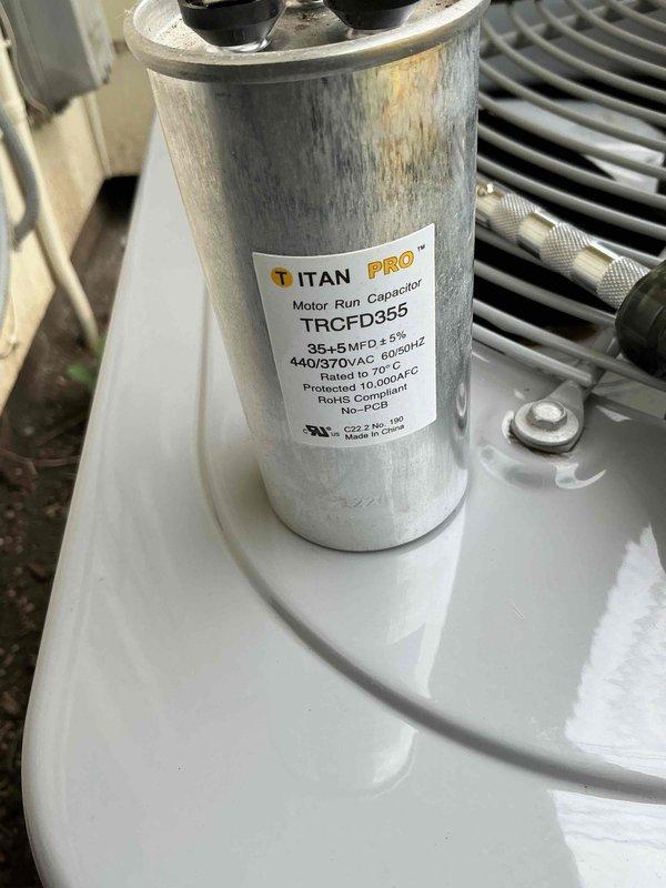 Completed routine cooling system maintenance and inspection as part of prepaid membership service. Performed comprehensive AC tuneup including temperature differential measurements showing 57.8°F readings, inspected TITAN PRO dual capacitor (TRCFD355, 35+5 MFD, 440/370VAC) which displayed surface discoloration but remained operational within specifications, and verified proper operation of outdoor condensing unit with all electrical connections secure and refrigerant lines properly attached.
