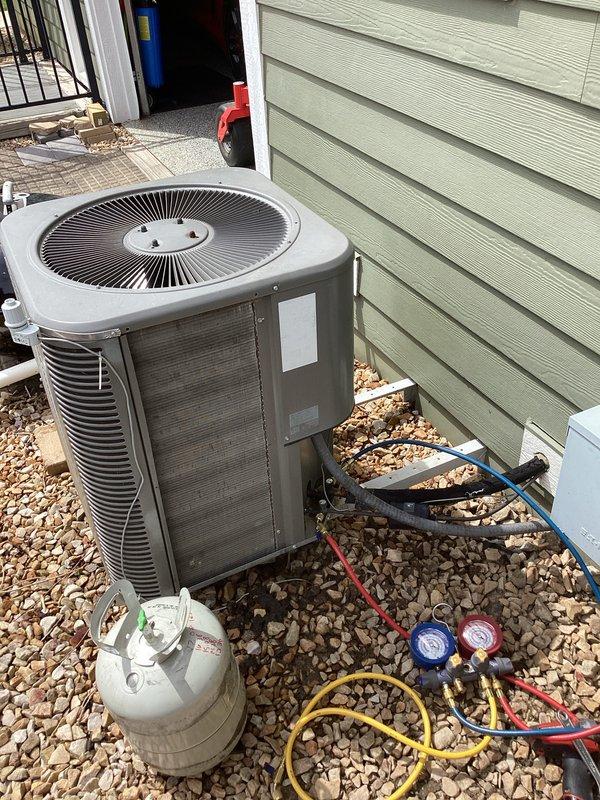 Responded to no-cool call on aging residential air conditioning system. Upon arrival, found unit running continuously without cycling off. Connected manifold gauges and performed system diagnostics on outdoor condenser unit. Checked refrigerant pressures, evaluated compressor operation, and inspected condenser coil condition. Coil showed accumulation of dirt and debris affecting heat transfer efficiency. Assessed thermostat communication and control circuit functionality to determine cause of continuous operation. Completed system evaluation and provided customer with findings and repair recommendations for proper system cycling and cooling performance.