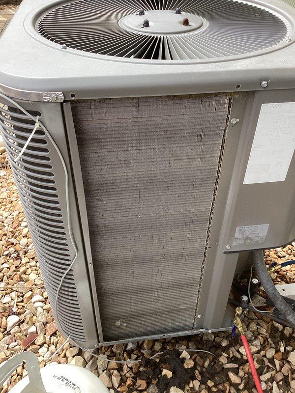 Responded to no-cool call on aging residential air conditioning system. Upon arrival, found unit running continuously without cycling off. Connected manifold gauges and performed system diagnostics on outdoor condenser unit. Checked refrigerant pressures, evaluated compressor operation, and inspected condenser coil condition. Coil showed accumulation of dirt and debris affecting heat transfer efficiency. Assessed thermostat communication and control circuit functionality to determine cause of continuous operation. Completed system evaluation and provided customer with findings and repair recommendations for proper system cycling and cooling performance.