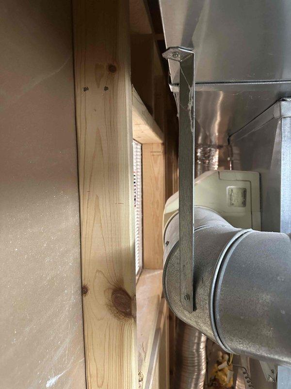 Conducted comprehensive HVAC system evaluation for non-functional air conditioning unit and existing furnace installation. Assessed current equipment condition, including dark gray furnace unit with associated PVC venting and ductwork configuration in unfinished basement mechanical room, as well as attic-mounted duct system components. Documented existing system specifications, reviewed equipment age and efficiency ratings, and provided replacement estimate options for complete HVAC system upgrade to restore cooling functionality and optimize heating performance.