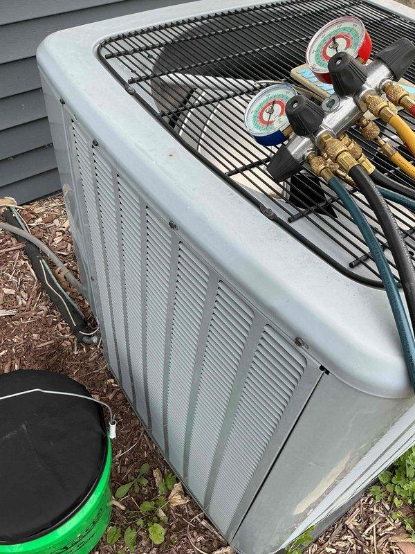 Responded to no cooling complaint on residential air conditioning system under warranty. Upon arrival, connected manifold gauge set to outdoor condensing unit to diagnose system performance. Inspected evaporator coil fins and condenser coil assembly, noting minor dust accumulation on heat exchanger surfaces. Measured refrigerant pressures and verified system operation, restored cooling functionality to unit.