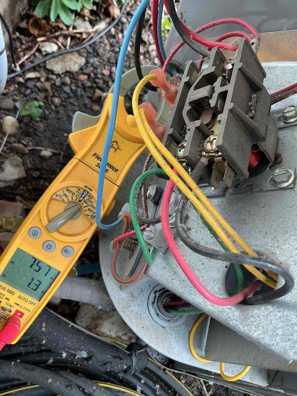 Responded to service call for odor coming from furnace. Upon arrival, performed comprehensive diagnostic evaluation and system tune-up as requested. Conducted electrical testing on outdoor unit using digital multimeter, measuring voltage and amperage at the contactor assembly to verify proper operation. All electrical connections showed normal readings with voltage at 75.7V on tested circuit. Inspected and tested all wire terminations including multi-phase connections to ensure secure contact points.

Proceeded with refrigerant system evaluation using manifold gauge set to measure operating pressures on both high and low sides of the system. Connected gauges to service ports and monitored system performance. All pressure readings fell within manufacturer specifications for current ambient conditions. Verified proper refrigerant charge and system operation through pressure analysis.

Completed visual inspection of outdoor condensing unit including condenser coil condition, electrical co