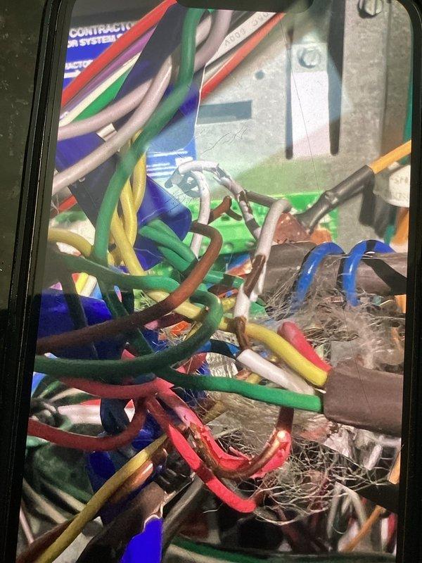 Responded to no cooling complaint on heat pump system. Upon arrival, connected manifold gauge set to verify system pressures and diagnose operational issue. Inspected control wiring at equipment, noting multiple low-voltage thermostat wires present in control panel. Performed diagnostic testing to identify cause of system failure and determine necessary repairs to restore cooling operation.