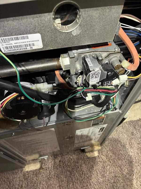 Completed prepaid membership cooling maintenance visit on residential HVAC system. Performed comprehensive system diagnostics using manifold gauges and digital meter to verify refrigerant pressures and temperatures. Inspected indoor furnace unit with access panel removed, checking gas valve assembly, electrical connections, and all internal components for proper operation and safety compliance. All systems tested and operating within normal parameters.