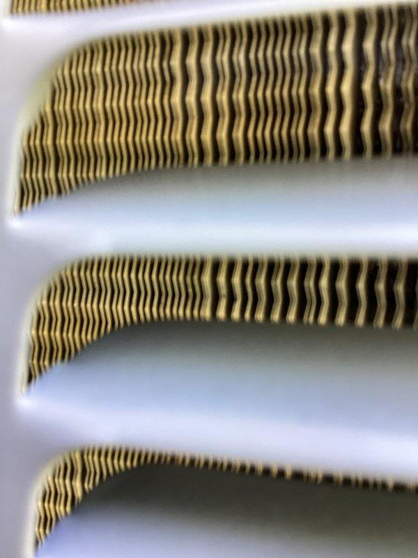 Completed annual tune-up on air conditioning system. Inspected evaporator coil fins and confirmed proper condition with minimal debris accumulation. Performed electrical diagnostics and verified system voltage readings within manufacturer specifications at 404V.