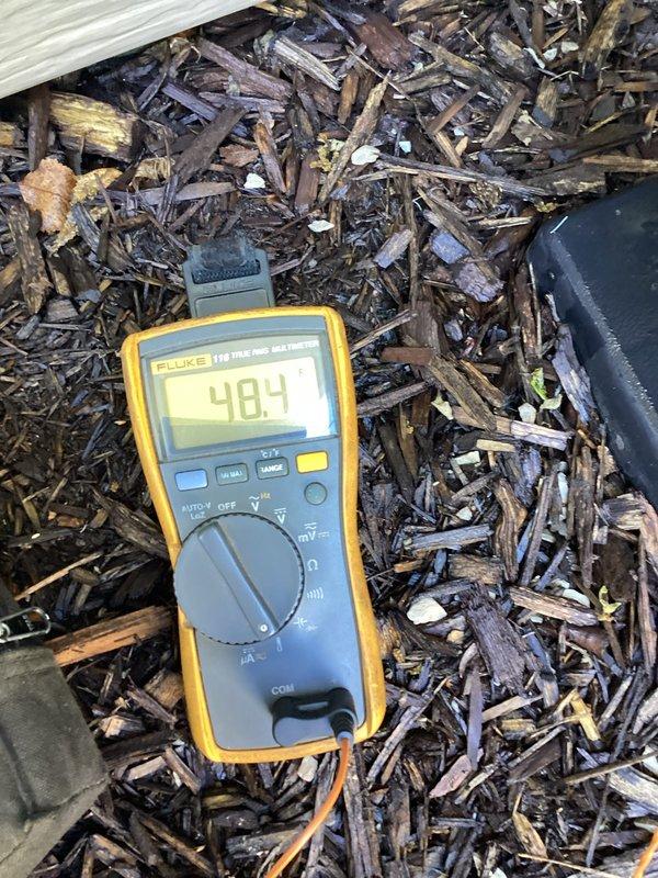 Completed annual tune-up on air conditioning system. Inspected evaporator coil fins and confirmed proper condition with minimal debris accumulation. Performed electrical diagnostics and verified system voltage readings within manufacturer specifications at 404V.