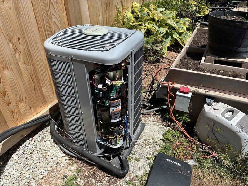 Responded to service call for thermostat error message indicating system malfunction with elevated indoor temperature. Performed diagnostic inspection of outdoor condensing unit and indoor air handler components, accessing both exterior cabinet and attic installation to evaluate electrical connections, refrigerant lines, and mechanical operation. System inspection completed with documentation of equipment condition and component accessibility for ongoing service needs.